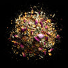 Mediterra floral reserve loose leaf tea blend with rose petals, lavender, hibiscus, chamomile, and exotic botanicals on black background