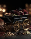 Luxury spice cart filled with saffron, cardamom, peppercorns, and exotic herbs on a dark background featuring mediterra co official website herb blend product.
