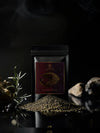 Front of Mediterra Zaatar Heritage Blend pouch with zaatar spice mound, olive leaves, and Mediterranean roots on a dark surface