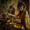 Traditional Mediterranean women preparing olives and pouring golden olive oil in an authentic rustic setting, cultural heritage food scene